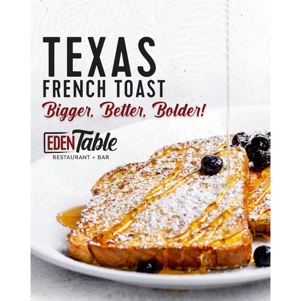 Texas French Toast from Eden Table, drizzled with syrup, powdered sugar, and blueberries.
